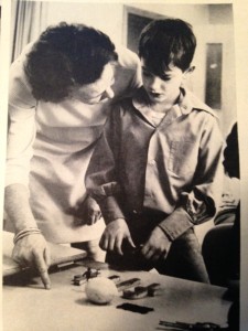 In an effort to work around his auditory handicaps, Joseph and his teacher Grace Reinhardt use cut-out letters and objects he can touch--a bit of fence, a lemon, a plastic Indian and the table itself--to spell the word, "flit."