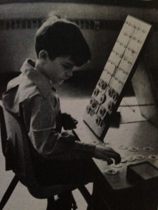 On the hook board, Joseph tries to do a perceptual problem--he must match identical designs. But his auditory difficulties have already betrayed him. Instead of starting at the top as he was told, he has started at the bottom.